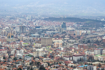 European mountain city seen from above at sunset on a cloudy day, Skopje the capital city.
