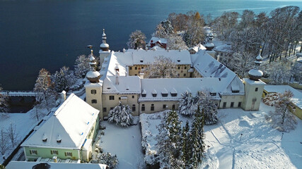 The country castle Ort on Lake Traunsee in Gmunden in winter with snow.