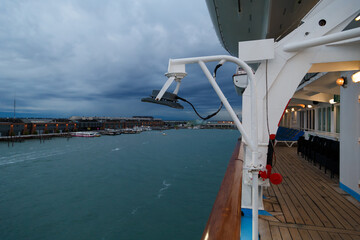 View of the Cruise Port of Venice from the open deck of the passenger cruise ship, evening, cloudy weather. Travel concept - obrazy, fototapety, plakaty