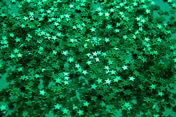 Mardi Gras green stars background. Festive green stars background. Holiday banner with green stars....