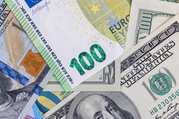 various freely convertible currencies euros and dollars stacked in a pile