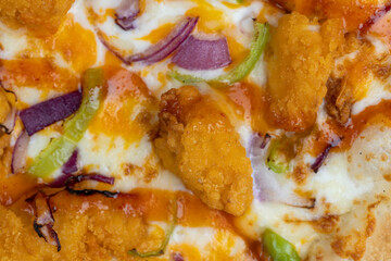 Fresh pizza with cheese and red onion with green pepper