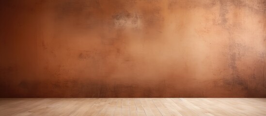 An empty room featuring a brown wall made of clay, a wooden floor, and a vintage background, with a rustic and exclusive interior design.