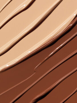 Makeup Liquid foundation range composition background. BB CC Cream Concealer texture. Cosmetic product brush swatch