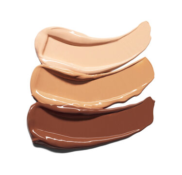 Makeup Liquid foundation smear composition isolated on white background. BB CC Cream Concealer texture. Cosmetic product brush swatch