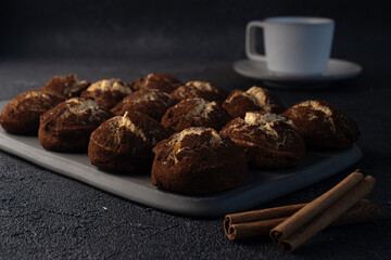 Cinnamon crinkle cookies and coffee on a black background