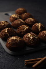 Cinnamon crinkle cookies on a black background