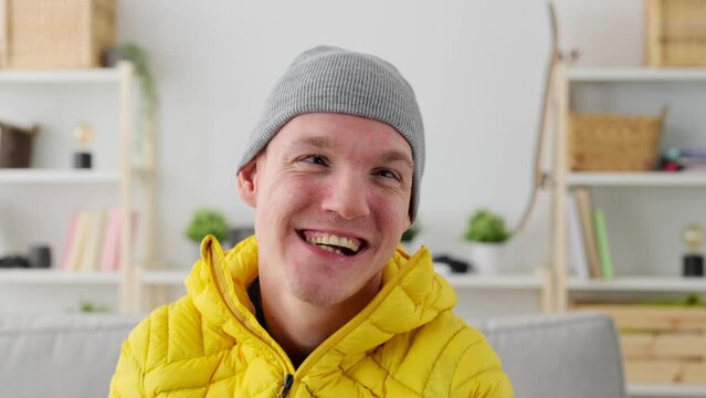 Portrait of happy smiling man with cerebral palsy sitting on wheelchair