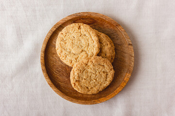 Oatmeal cookies on a wooden plate