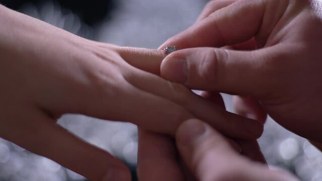 Man Put Engagement Diamond Ring On His Fiancee