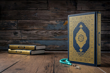 Ramadan, Islamic concept - The Holy Al Quran with written Arabic calligraphy meaning of Al Quran...