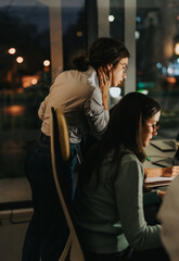 A group of professionals working together in a modern office, focused on solving problems and driving growth for their company.