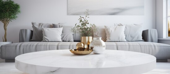 A living room filled with various pieces of furniture, with a prominent white table in the center featuring a marble top. The room is well-lit, creating a bright and inviting atmosphere.