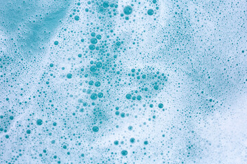 Detergent foam bubble on water. Blue background, Soap sud