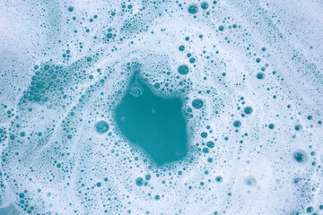Detergent foam bubble on water. Blue background, Soap sud - obrazy, fototapety, plakaty