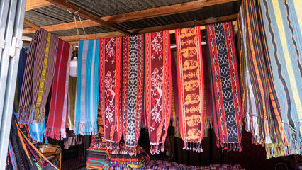 A selection of traditional cultural colorful woven tais scarfs at market in Timor-Leste, Southeast...