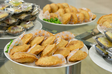 Jajanan pasar, various Indonesia traditional market snack, such as pastel, risol, donat, onde-onde and martabak mini.