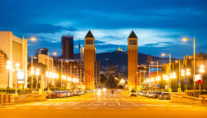 Cityscape of evening Placa d'Espanya with view of twin Venetian Towers. - obrazy, fototapety, plakaty