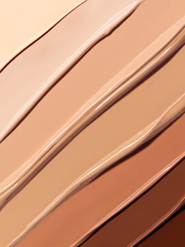 Makeup Liquid foundation composition background. BB CC Cream Concealer texture. Cosmetic product brush swatch
