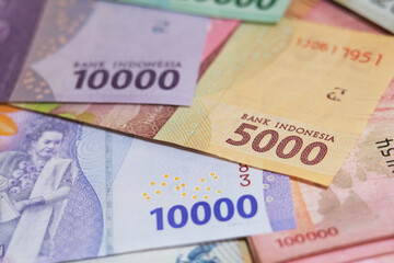 Close up of Rupiah banknotes. The rupiah is the official currency of Indonesia issued and...