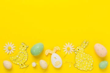 Easter eggs and decoration on color background, top view