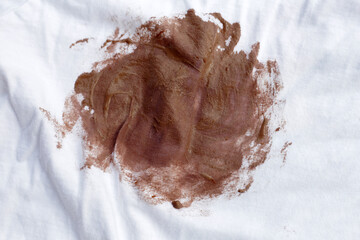 Dirty stain chocolate ice cream  on white clothes