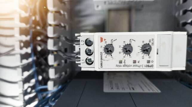 Close up Three phase voltage relay on the panel control board.