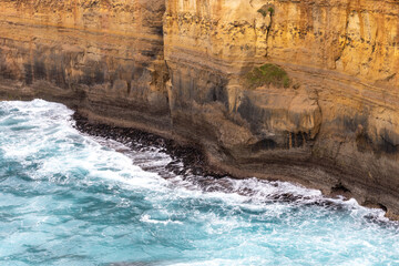 Waves breaking on the rock shelfs near Loch Ard Gorge located in Port Campbell Victoria Australia on October 3rd 2023