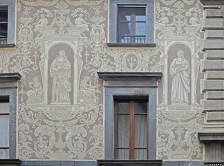 Ornate detailled fresco picturing L'Aqua (the water) La Terra (the earth), Energia (energy) and Vita (life) on a gable in the streets of Orvieto, Italy