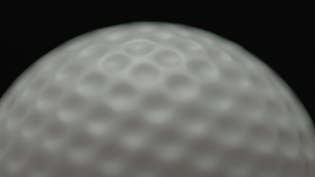 Dramatic, cinematic macro texture shots of a golf ball