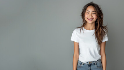 Obraz premium Malay woman wear white t-shirt smile isolated on grey background