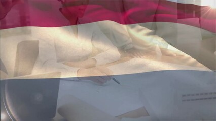 Animation of flag of netherlands over diverse female and male architects discussing blueprints - Powered by Adobe