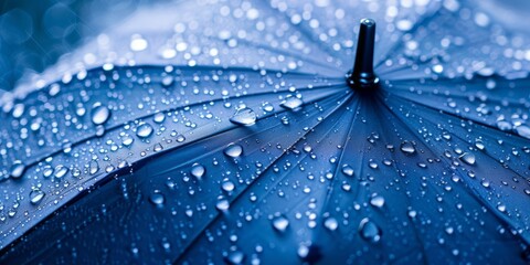 A blue umbrella, on top of the rain, is presented, showcasing a soft-focus technique, a close-up view, and colors of light white, dark aquamarine, dark indigo, and blue against a white background. - obrazy, fototapety, plakaty