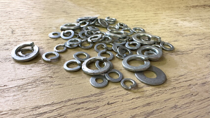 a washers fasteners flat spacer close industrial tool closeup workshop metal repairs mechanical working repair mechanic industry pile object hardware construction screw washer stainless metallic zinc