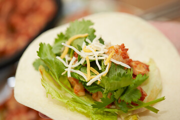 A Mexican food where meat, beans, vegetables