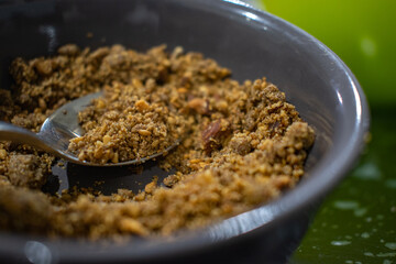 Sfouf a traditional Moroccan sweet meal for iftar during the Ramadan month also known as Zamita and Sellou made of Roasted flour, differents kinds of nuts, herbs, and honey