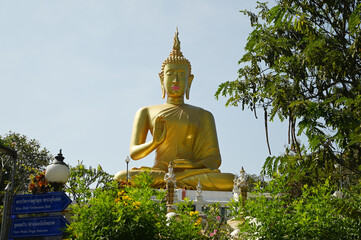 Phra Phut Tha Maha Phratimakhon It is a large golden Buddha image sitting outdoors on a hill. Inside Wat Phra That Doi Saket. This temple is another important one in the Northern part of Thailand. 