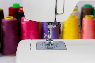 Colorful threads are used on sewing machines.