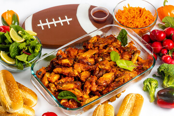 For football game parties, wings come with dip sauce and salad.