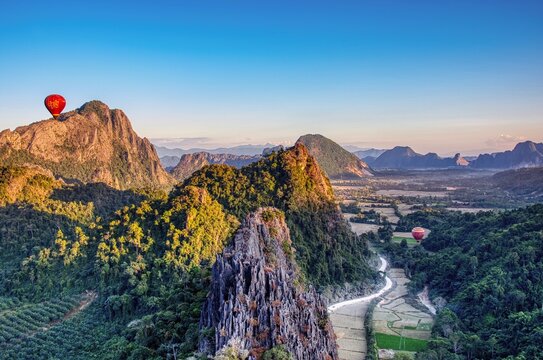 Vang Vieng Hot Air Ballone Viewpoint, Pha Poungkham Amazing mountain and sunset scenery Street in the valley air balloons in the air wallpaper hdr