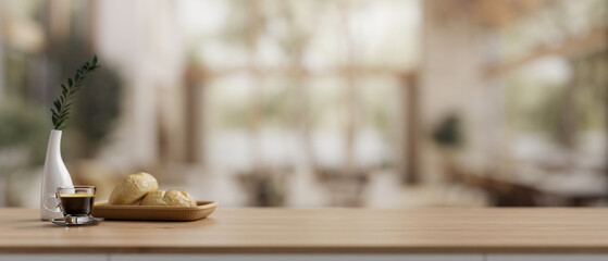 An empty space on a wooden tabletop in a contemporary and comfortable cafe.