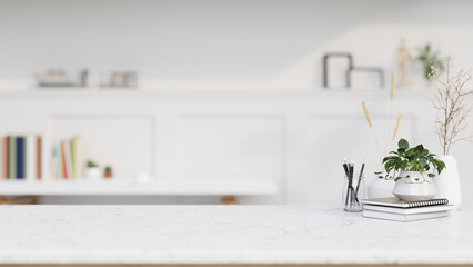 A copy space for display product on a white marble tabletop in a contemporary white home office.