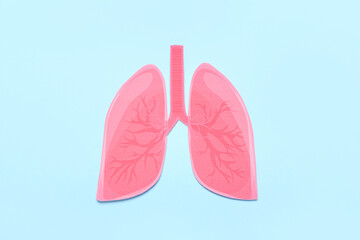 Paper lungs on blue background