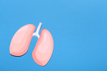 Paper lungs on blue background