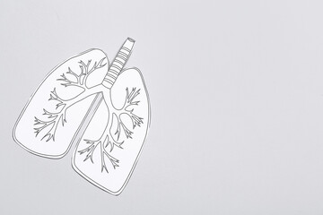 Drawn paper lungs on grey background