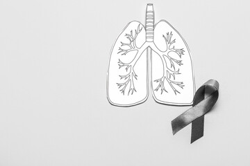 Drawn paper lungs with ribbon on grey background