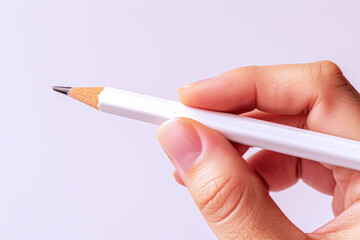 Hand holding a white pencil, business economy financial concept