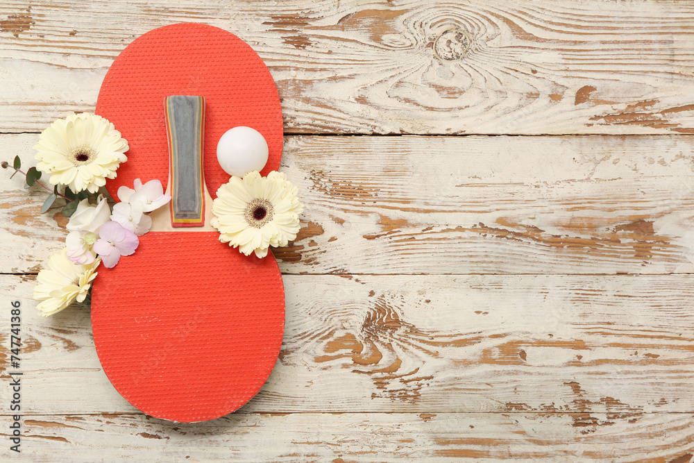 Wall mural Composition with ping pong rackets, ball and flowers on light wooden background. International Women's Day - Wall murals