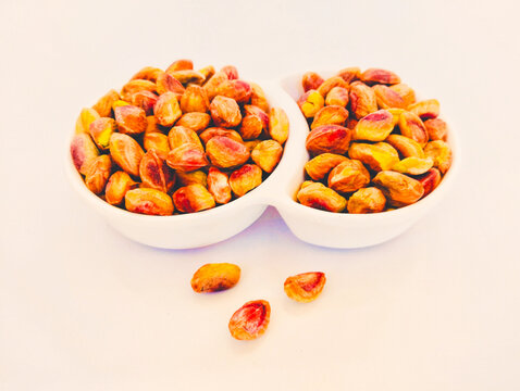 Pistachio nut kernels dry fruit food in a bowl pista  pistacho closeup view image stock phot