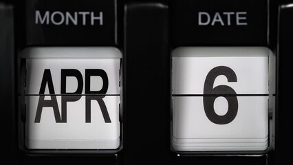 retro flip calendar with a date change from the fifth of April to the sixth of April. daily calendar with a change of days of the month. close up.